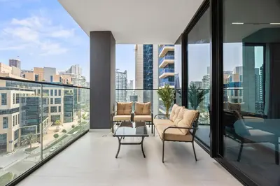 a balcony with chairs and a view of the city at Trillionaire Residences By Binghatti - Classy 2BR in Dubai