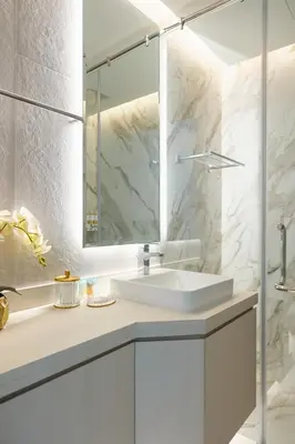 a white bathroom with a sink and a shower at Star of Dubai Marina 2 Br 5 Guests in Dubai