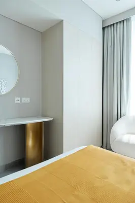 a bedroom with a bed and a mirror at Star of Dubai Marina 2 Br 5 Guests in Dubai