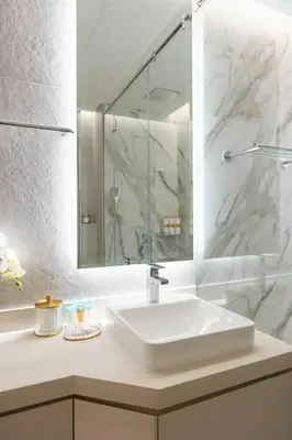 a bathroom with a white sink and a mirror at Star of Dubai Marina 2 Br 5 Guests in Dubai