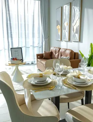 a living room with a table and a couch at Private Pool I Sleeps 6 I Circle Mall in Dubai