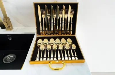 a set of forks and knives in a wooden box at Private Pool I Sleeps 6 I Circle Mall in Dubai
