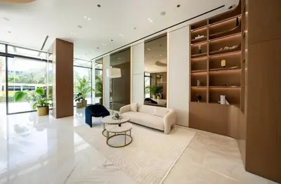 a living room with a couch and a table at Private Pool I Sleeps 6 I Circle Mall in Dubai