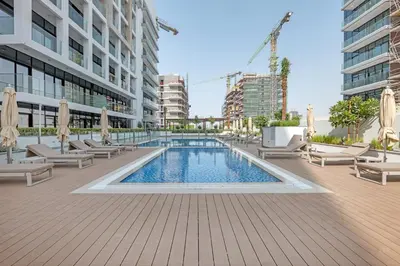 a swimming pool in the middle of a building at Elegant Studio Retreat in the Heart of Dubai in Dubai