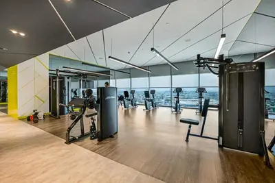 a gym with a lot of equipment in a building at Elegant 1 Bedroom Retreat in Business Bay in Dubai