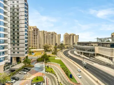 an aerial view of a city with tall buildings at Wonderful Stay at 7 Palm - Rooftop Infinity Pool - Direct Beach Access - Brand New Luxury Apartments in Dubai