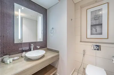 a bathroom with a sink and a mirror at Stylish Stay - 1 Bedroom - High Floor in Dubai