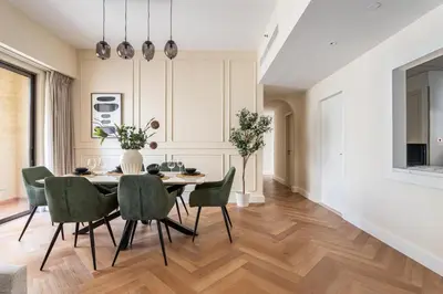 a dining room with a table and chairs at GuestReady - 2BR | JBR Beach Stay | Canal View in Dubai