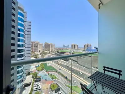 a view of a city from a balcony of a building at LUX Infinity Pool, Gym, Beach, Parking Studio in Dubai
