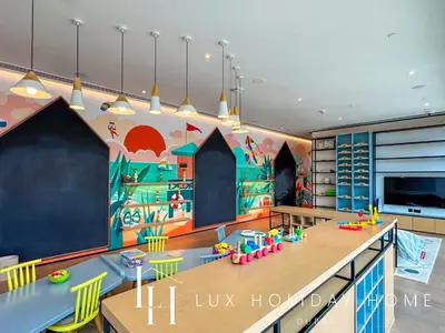 a room with a classroom with a table and chairs at LUX The Vida Marina Residence in Dubai