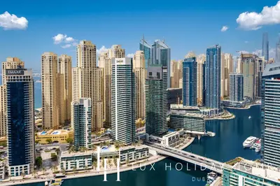 an aerial view of a city with tall buildings at LUX The Vida Marina Residence in Dubai