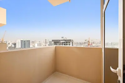 a balcony with a view of a city at FIRST CLASS Studio Cozy Elegance in Dubai