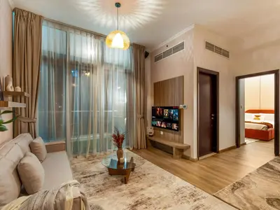a living room with a couch and a large window at Urban Dubai Marina Stay, Near Yacht Area & Beach Sleep 8 Pax in Dubai