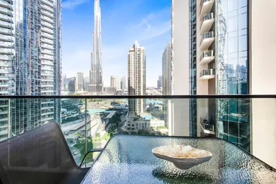 a table with a bowl on top of a glass table at Act One Luxury 2BR Front-Row Burj & Fountain Views in Dubai