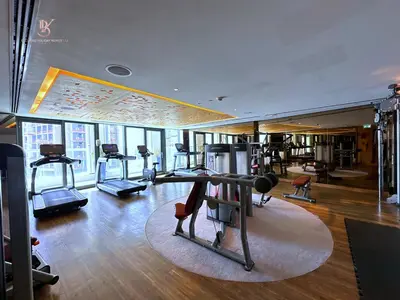 a gym with treadmills and exercise equipment in a building at Your Hollywood-Style Hideaway -DAMAC Paramount in Dubai