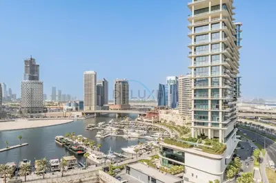 a view of a city with a river and buildings at Burj Khalifa and Dubai Canal Views, Minutes from Downtown Dubai, Convenient Metro Access - 15 Northside Tower 2, Business Bay by Deluxe Holiday Homes in Dubai