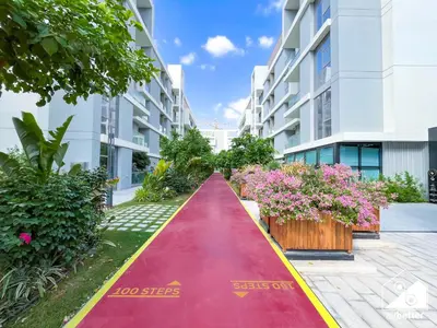 a red carpet path in front of a building at Spacious 1-BR with Balcony & Leisure Facilities in Dubai