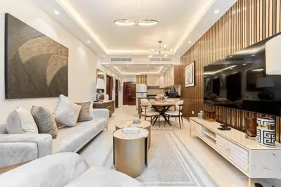 a living room with a couch and a table at FAM Living Elite Residence 1BR Walk to JBR Beach in Dubai