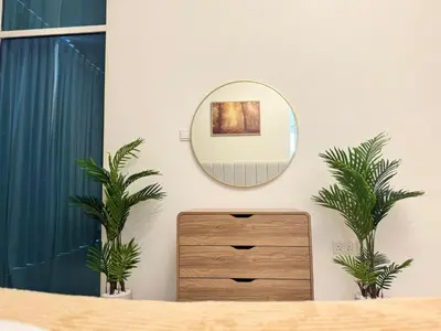 a dressing room with a mirror and a dresser at Stylish One Bed Apartment near Downtown in Dubai