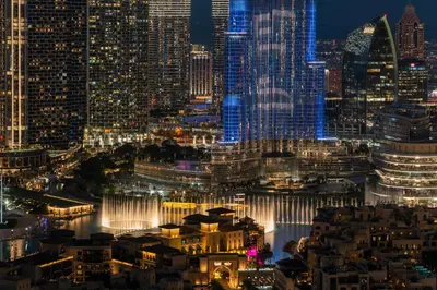 a view of the city at night at DAMAC MAISON DISTINCTION - Burj Khalifa View, Fee Parking in Dubai
