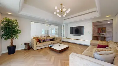 a living room with two couches and a tv at Vacationer l Family Villa with Private Pool, Private Garden in Dubai