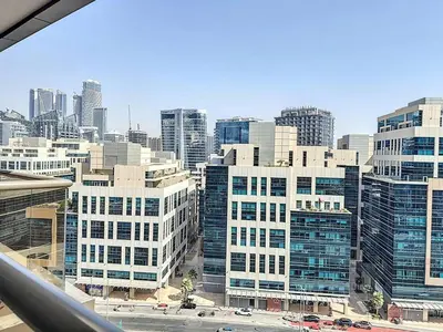 a view of a city skyline with tall buildings at Stylish Studio in Elite Downtown in Dubai