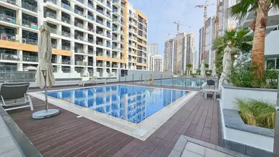 a swimming pool in the middle of a building at Downtown-Close Studio by Czech-In in Dubai