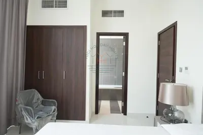 a bedroom with a bed and a mirror and a chair at Spacious Private 4-Bedroom Villa for Families & Groups in Dubai
