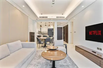 a living room with a couch and a table at Relaxing 2BR in Business Bay Mins to Burj Khalifa in Dubai