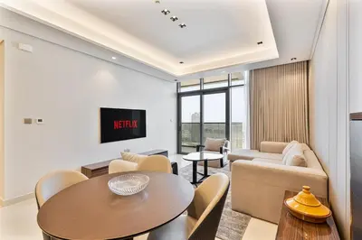 a living room with a table and a couch at Relaxing 2BR in Business Bay Mins to Burj Khalifa in Dubai