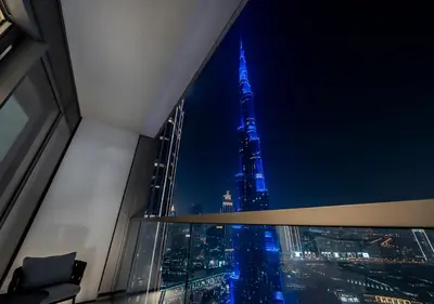 a view of the tallest building in the world at night at Iconic Burj Khalifa & Fountain Views, Luxury 2BR Downtown in Dubai