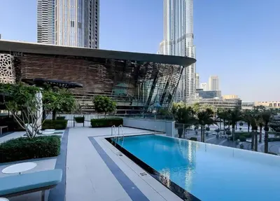 a swimming pool on the roof of a building at Iconic Burj Khalifa & Fountain Views, Luxury 2BR Downtown in Dubai