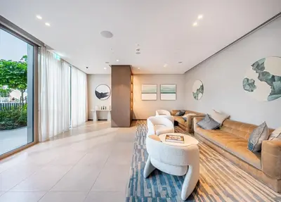 a living room with a couch and a table at Iconic Burj Khalifa & Fountain Views, Luxury 2BR Downtown in Dubai