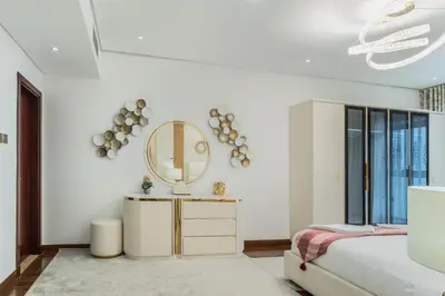 a bedroom with a bed and a mirror on the wall at 83rd Floor Luxurious Penthouse Full Sea View 6 BHK in Dubai