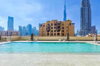 a swimming pool on the roof of a building at Celestial & Curated 1BR Downtown Dubai in Dubai