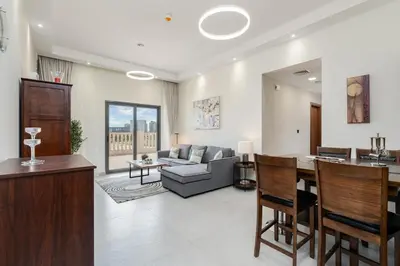 a living room with a couch and a table at Elegant 2Bhk Panorama Apartment in Dubai