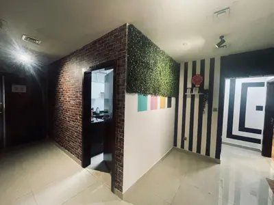a room with a brick wall and a doorway at Affordable Hostel in Al Barsha 1 Near Mall of Emirates Metro in Dubai