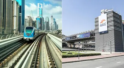 a blue train on the tracks in a city at Affordable Hostel in Al Barsha 1 Near Mall of Emirates Metro in Dubai
