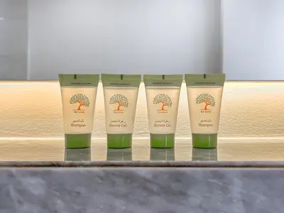 a group of four products sitting on a shelf at The Pad luxury 1BR with full Canal View in Dubai