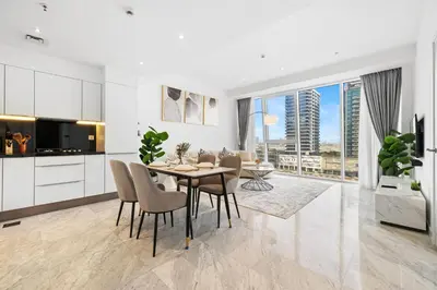 a kitchen and dining room with a table and chairs at The Pad luxury 1BR with full Canal View in Dubai