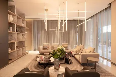 a living room with a couch and chairs and a table at Moon Stays - Canal View- 2BR Missoni Stay in Dubai