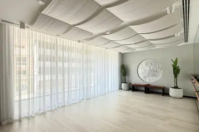a large room with white ceilings and large windows at New Studio in JVC - Hamilton House at 5th floor in Dubai
