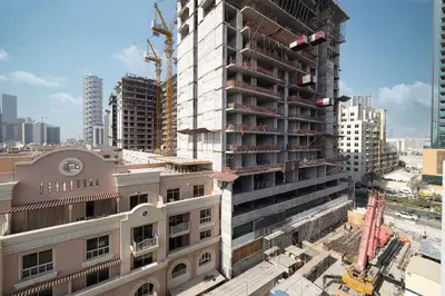 a tall building under construction in a city at New Studio in JVC - Hamilton House at 5th floor in Dubai