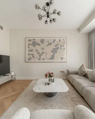 a living room with a couch and a coffee table at Elegant 2-Bedroom Apartment with Breathtaking Cityscape in Dubai