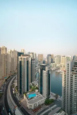 an aerial view of a city with tall buildings at Elegant 2-Bedroom Apartment with Breathtaking Cityscape in Dubai