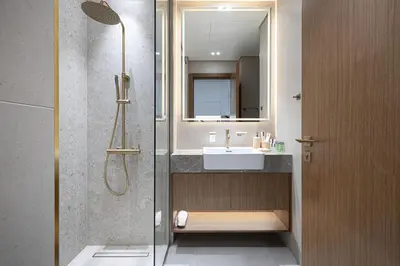 a bathroom with a sink and a shower at PNB Living - Luxury Studio with Canal Views - Trillionaire Residences, Business Bay in Dubai