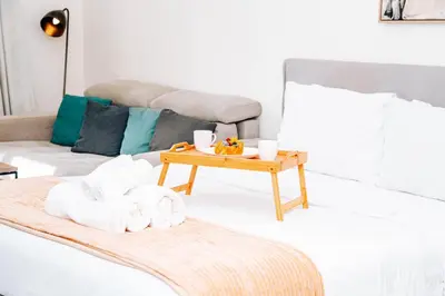 a living room with a coffee table and a couch at Skyline Views, Fully Equipped Studio with Balcony, Near Burj Khalifa in Dubai