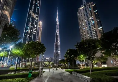a view of the burj khalifa at night at Act 2 - Luxury 2BR Facing Burj Khalifa & Fountain in Dubai