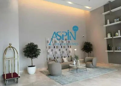 a living room with a couch and a table at Aspin 1BHK Waterfront View - Creek Horizon in Dubai