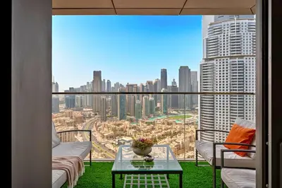 a balcony with a view of a city at Cosmic Address 2BR Burj Views above Dubai Mall - By Maxx Value Homes in Dubai